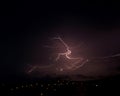 Night dark sky with a bright lightning strike over a city Royalty Free Stock Photo