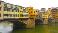 A night and day view of famous ponte vecchio bridge on the arno river florence Royalty Free Stock Photo