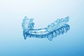 Night dental guard by bruxism on blue background