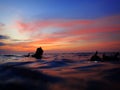 Getting ready for an adventure of night dive with beautiful sunset view on surface. Royalty Free Stock Photo