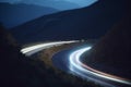 Night Drive on a Curvy Mountain Road with Long Exposure Light Trails Royalty Free Stock Photo