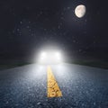 Night driving on an asphalt road towards the headlights Royalty Free Stock Photo