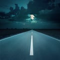 Night driving on an empty road to the moon Royalty Free Stock Photo