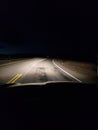 Night driving on a two lane rural road Royalty Free Stock Photo