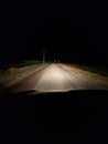 Night driving on a two lane rural road Royalty Free Stock Photo