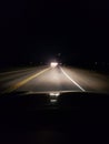 Night driving on a two lane rural road Royalty Free Stock Photo