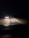 Night driving on a two lane rural road Royalty Free Stock Photo