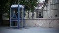 Night Eastern Europe. Young man is calling for a payphone