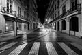Night on the empty streets of the old city of Lisbon. Empty tram tracks. Portugal. Black and white