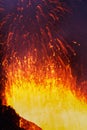 Night eruption volcano: fountain red hot lava erupting from crater. Kamchatka Peninsula, Russian Far East, Eurasia