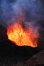 Night eruption volcano - lava lake, lava flowing in crater