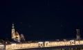 Night European city Salzburg landmark long exposure photography urban view with fuzzy bridge yellow illumination lamps and church