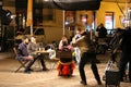 Night film scene shooting in historic heart of the city, film crew and actors, Krakow, Poland