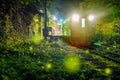 At night, fireflies fly around on the railway tracks in the mountains. Royalty Free Stock Photo