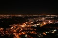 Night flight city lights in a valley
