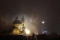 Night fog over Saint Nicholas Church in Prague, Czech Republic. Royalty Free Stock Photo