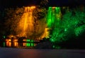 Night fonan in colorful lights, falling jets of water in a park Royalty Free Stock Photo