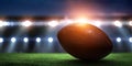Night football arena in lights with a ball close up Royalty Free Stock Photo