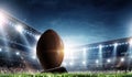 Night football arena in lights with a ball close up Royalty Free Stock Photo