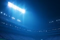 Night game charm Stadium lights in vivid blue, creating visual allure Royalty Free Stock Photo