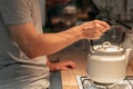 Night habit insomnia tea man putting kettle stove Royalty Free Stock Photo