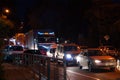 Night highway - cars drive along a narrow road. Headlights, cars, road, traffic