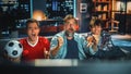 Night At Home: Three Joyful Soccer Fans Sitting on a Couch Watch Game on TV, Worry and Celebrate