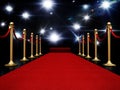 Night illuminated with flashlights, red carpet and velvet ropes 3D illustration Royalty Free Stock Photo