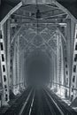 Night, illuminated railway bridge in black and white tones Royalty Free Stock Photo