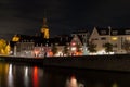 Night image of downtown Maastricht with the Meuse river and city upcoming area Wyck with a view on a beer brewery Royalty Free Stock Photo