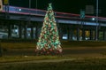Night image of a Lighted Christmas Tree next to Interstate 20