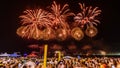 Night image with New Year`s Eve RÃÂ©veillon fireworks exploding in the sky. Royalty Free Stock Photo