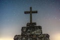 night image with stars visible in the sky with Christianity Catholic religious crucifix in the center.