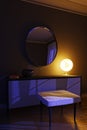 Night interior in a modern style with an unusual lamp. Royalty Free Stock Photo