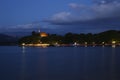 Night at lake with light over the cost