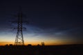 Night landscape with electric line and Noctilucent clouds