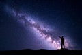 Night landscape with Milky Way and silhouette of a man Royalty Free Stock Photo