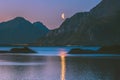 Night landscape moon reflection in water Norway mountains and fjord travel tranquil scenery