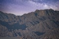 Night landscape, mountain range, rocks, stone peaks against the background of the night sky with stars and the Milky Way, Sinai Royalty Free Stock Photo