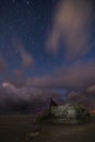 A night landscape of an old German bunker transformed into mules on the beach of Blavand, Denmark, with moving clouds Royalty Free Stock Photo