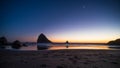 Night landscape of pacific ocean beach in USA, cliffs, and night stars. Beautiful sunset Royalty Free Stock Photo