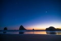 Night landscape of pacific ocean beach in USA, cliffs, and night stars. Beautiful sunset Royalty Free Stock Photo