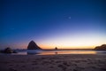 Night landscape on the pacific ocean, Cannon beach. Stars and cliffs, sunset time Royalty Free Stock Photo