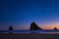 Night landscape on the pacific ocean, Cannon beach. Stars and cliffs, sunset time Royalty Free Stock Photo