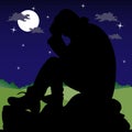 Night landscape, a sad man sitting on a stone, silhouette on a d Royalty Free Stock Photo