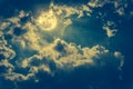 Night landscape of sky with cloudy and bright full moon with shiny. Cross process. Royalty Free Stock Photo