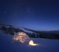 Winter night landscape with a snow igloo and a starry sky Royalty Free Stock Photo