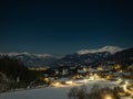 Night landscape with starry sky in the Alps, with street lights and villages in the valley, Millstatter See