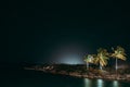 Night landscape of tropical island with palm trees on the shore under  starry sky in Exuma, Bahamas Royalty Free Stock Photo