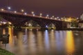 Night landscape view of illuminated Old Bridge also named the State over Drava River. Popular travel destination in Maribor Royalty Free Stock Photo